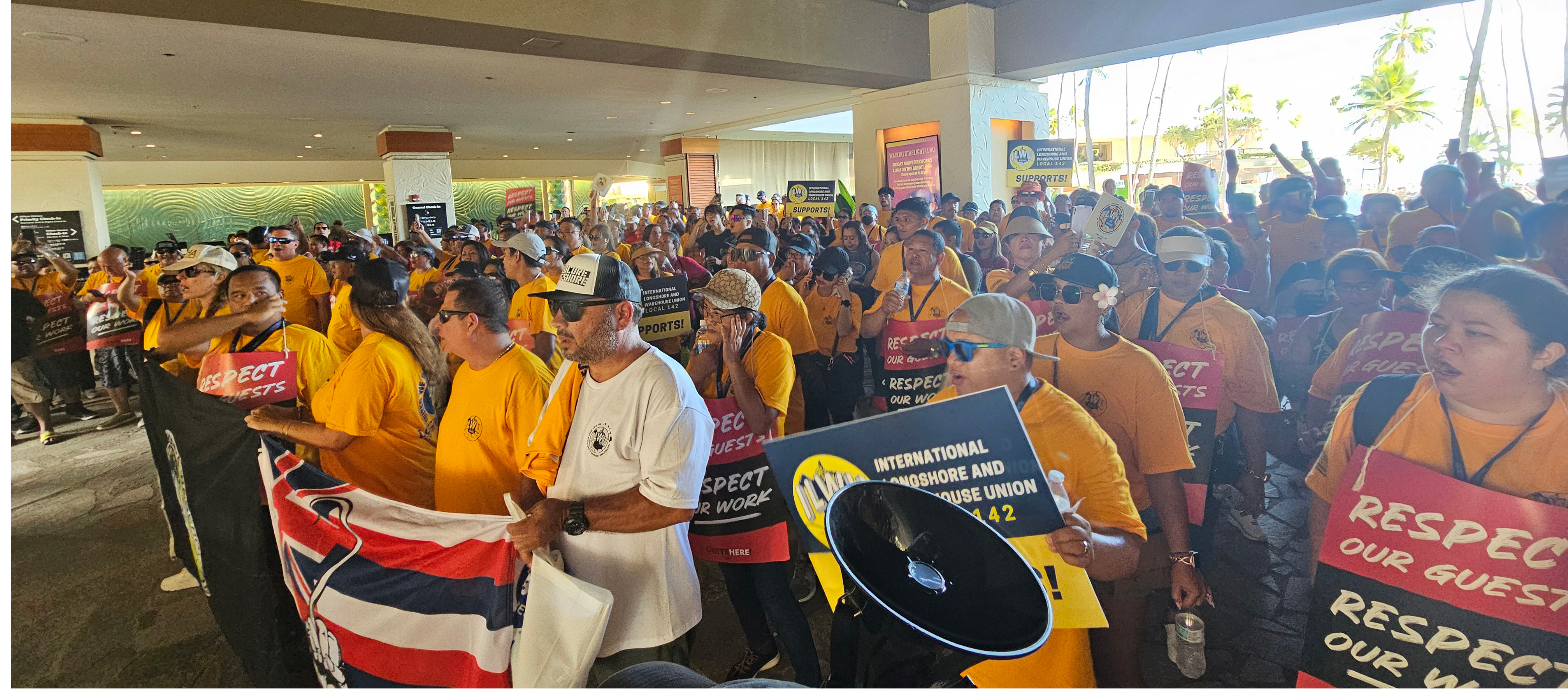 ILWU and Local 5 members fill the lobby of the Hilton Hawaiian Village in Waikīkī in a solidarity rally. 